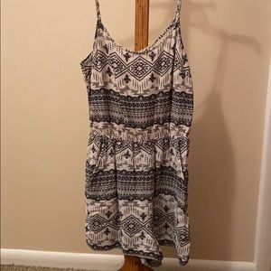 Black and white romper. Crisscross back. Pockets